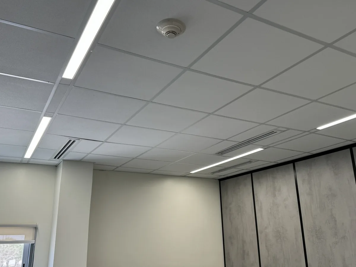 Lay-in ceiling tiles with linear lights and slot diffusers