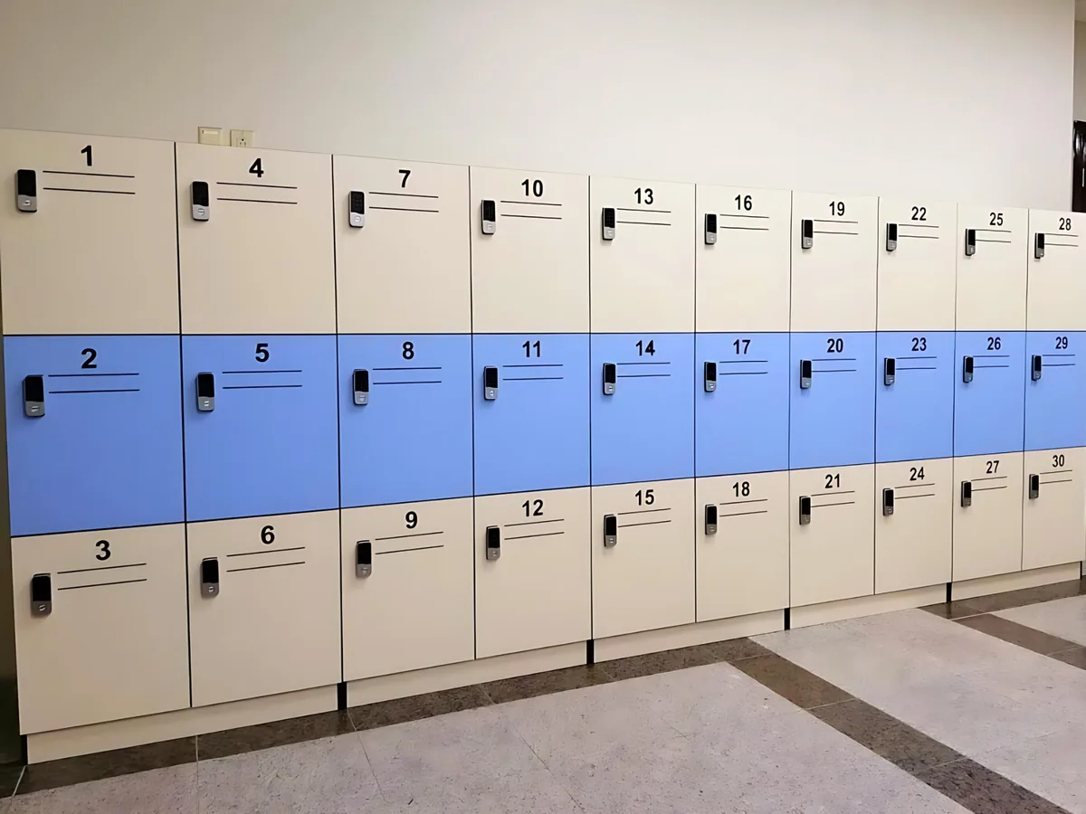 Locker bank with numbered doors, a contrasting middle row and electronic locks
